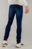 Jean azul intenso súper skinny con tiro bajo y desgastes de color