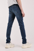 Jean slim tiro bajo azul intenso con desgastes sutiles de color