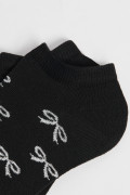 Medias unicolores tobilleras con diseño de moños