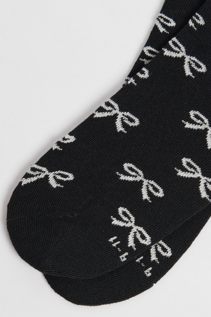 Medias unicolores tobilleras con diseño de moños