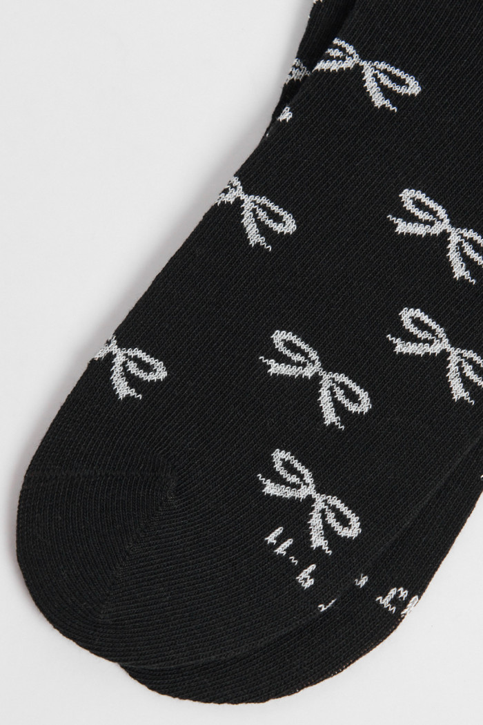 Medias unicolores tobilleras con diseño de moños