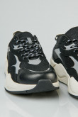 Tenis chunky negros con detalles reflectivos