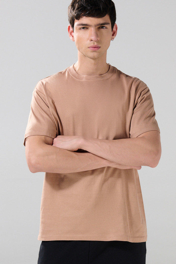 Camiseta en algodón unicolor manga corta con hombro rodado