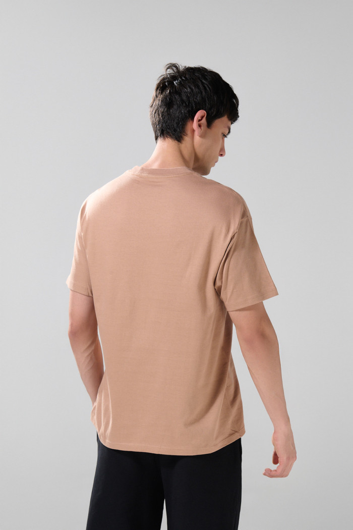 Camiseta en algodón unicolor manga corta con hombro rodado