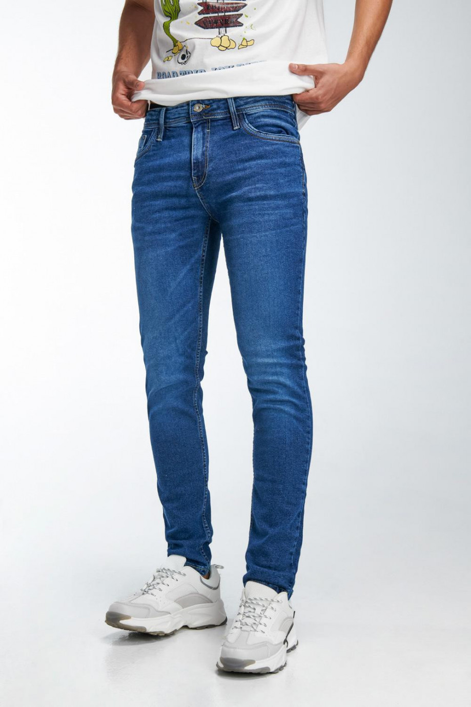 Jean azul oscuro tiro bajo skinny con costuras en contraste