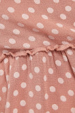 Blusa rosada manga larga con estampado de puntos y frentes cruzados
