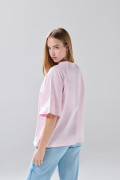 Camiseta manga ranglan corta rosada college oversize