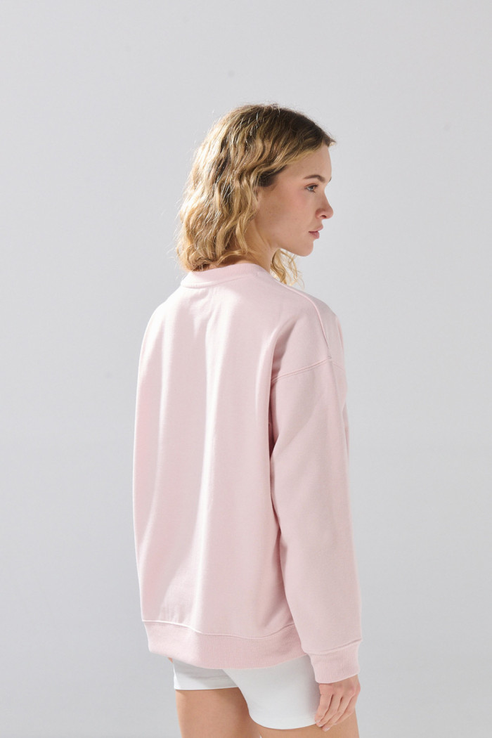 Buzo oversize cuello redondo unicolor con hombro caído
