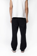 Jean loose gris intenso con bota ancha, tiro medio y cortes
