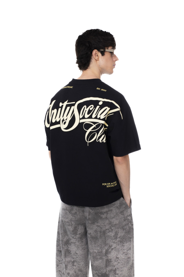 Camiseta oversize unicolor con textos y manga corta
