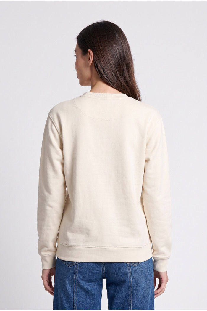 Buzo oversize con capota crema claro y artes college
