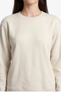 Buzo oversize con capota crema claro y artes college

