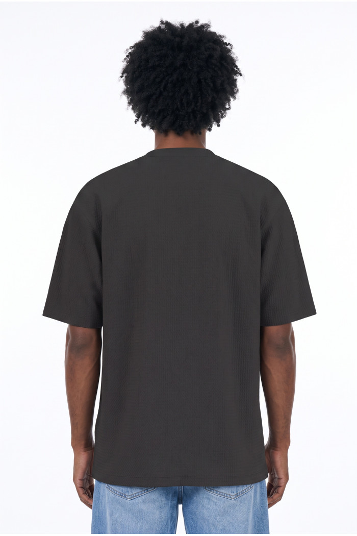 Camiseta unicolor oversize manga corta con corte posterior
