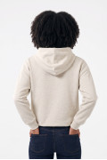 Buzo oversize crema con capota y texto college en frente
