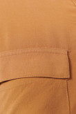 Blusa unicolor manga corta con detalle de anudado en frente