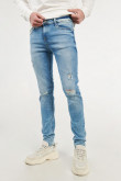 Jean súper skinny azul claro con rotos en frente y efectos desteñidos