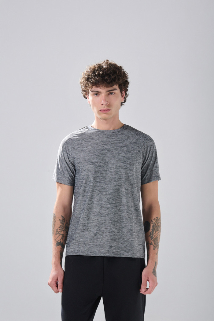 Camiseta unicolor con manga ranglan corta y estampados
