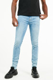 Jean azul claro skinny fit tiro bajo con detalles desteñidos