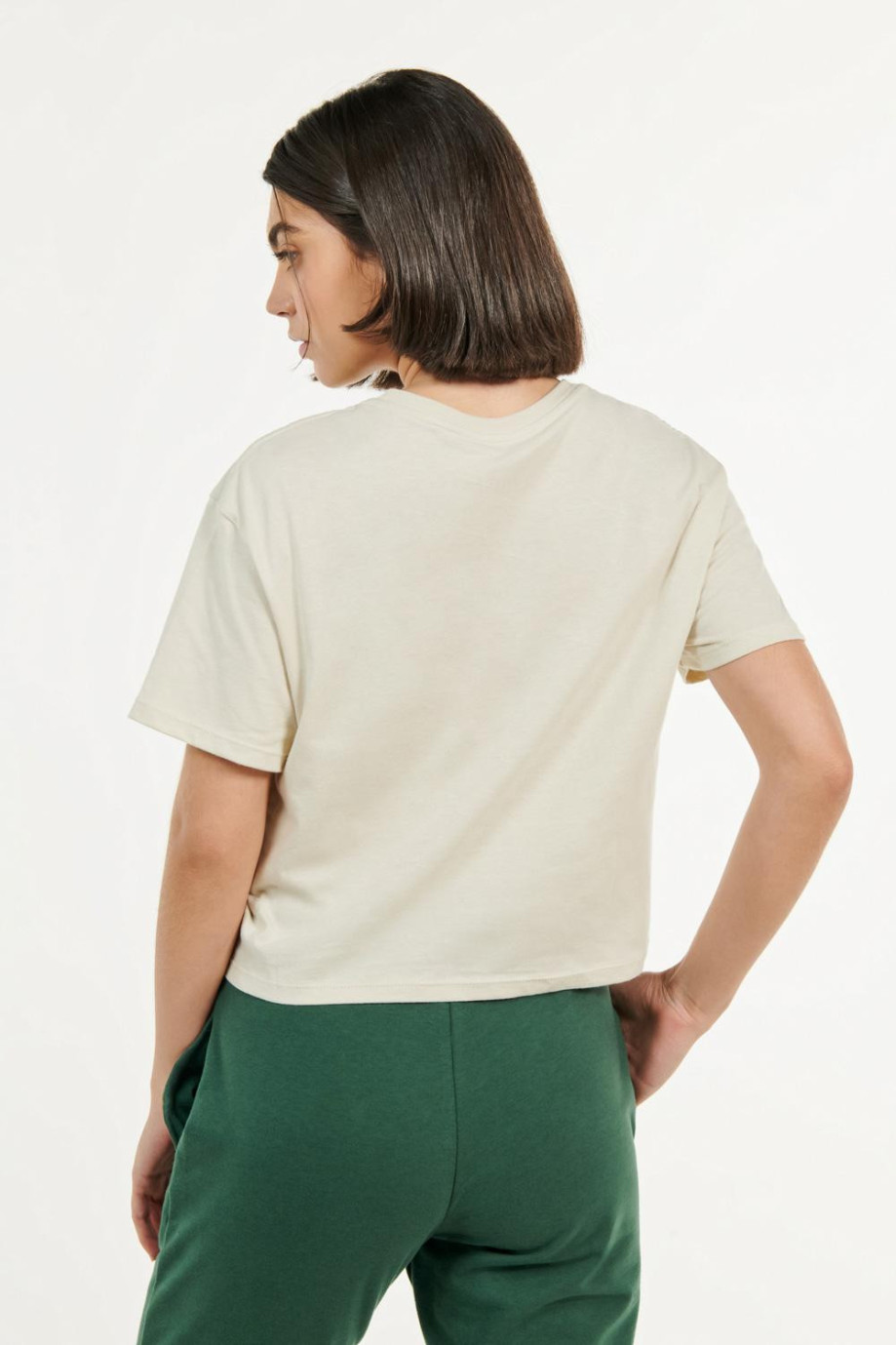Camiseta unicolor crop top con cuello redondo en rib y manga corta