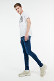 Jean súper skinny azul oscuro tiro bajo con costuras amarillas