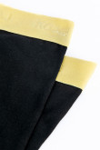 Bóxer negro tipo midway brief con elástico amarillo en la cintura
