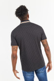 Camiseta polo negra con diseños de puntos blancos estampados