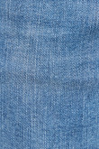 Jean súper skinny azul medio con desgastes de color y tiro bajo