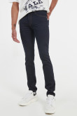 Jean skinny tiro bajo azul intenso con bolsillos y costuras en contraste