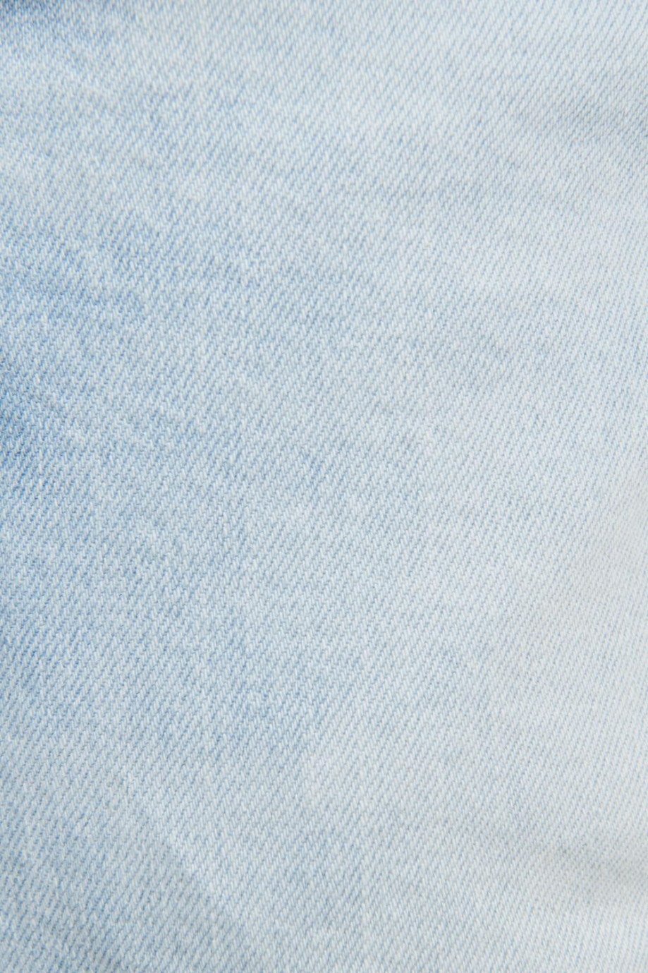 Jean slim azul claro con tiro bajo y efectos con desgastes de color