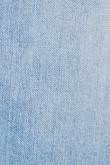 Jean skinny azul claro con tiro bajo y efectos con desgastes de color