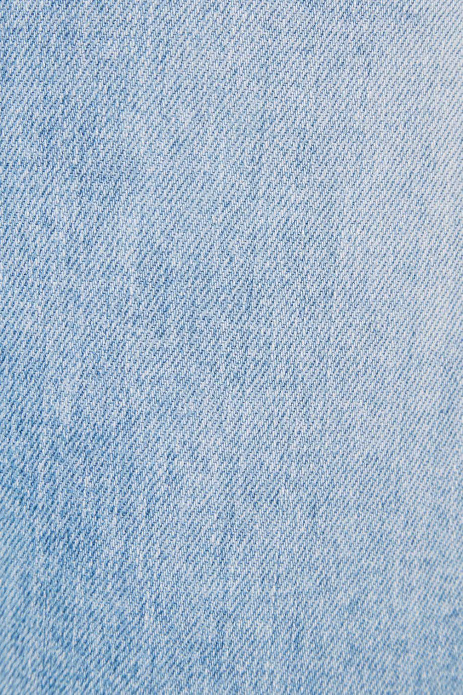Jean skinny azul claro con tiro bajo y efectos con desgastes de color