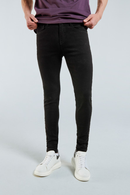 Jean negro súper skinny ajustado con bolsillos y tiro bajo