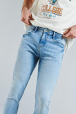 Jean skinny azul claro con efectos desteñidos y tiro bajo