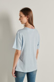 Camiseta oversize azul clara con cuello redondo y diseño de Los Picapiedra