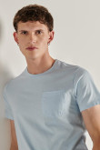 Camiseta unicolor en algodón con bolsillo y cuello redondo