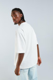Camiseta crema clara oversize con manga corta y hombro caído