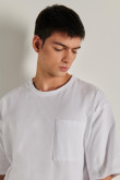 Camiseta oversize unicolor con manga corta y bolsillo