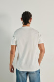 Camiseta crema manga corta con texto college delantero