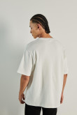 Camiseta unicolor oversize con cuello redondo y manga corta