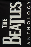 Camiseta manga corta negra y diseño de The Beatles