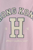 Buzo rosado claro con capota y texto college de Hong Kong