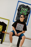 Camiseta manga corta negra oversize y diseño de Keith Haring