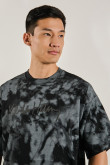 Camiseta negra tie dye oversize con diseño de Keith Haring