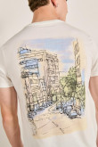 Camiseta crema con bolsillo, arte de paisaje y manga corta