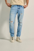 Jean azul claro skinny tiro bajo con rotos y parches