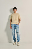 Jean azul claro skinny tiro bajo con rotos y parches