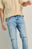 Jean azul claro skinny tiro bajo con rotos y parches