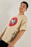 Camiseta oversize kaki manga corta con arte de Keith Haring