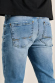 Jean azul claro skinny tiro bajo con bolsillos y desgastes