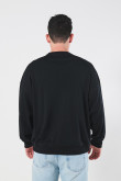 Buzo negro cuello redondo oversize con hombro rodado